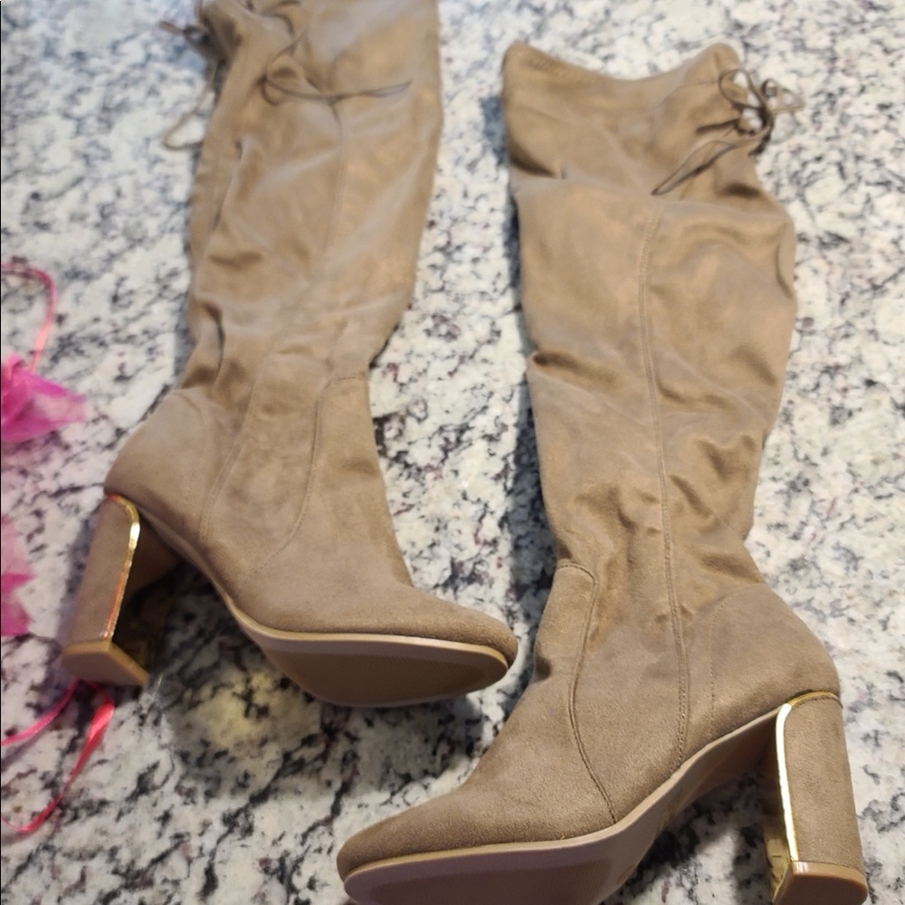 Beautiful tan boots with gold details design.